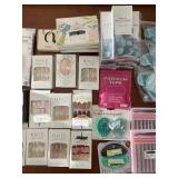 Large Group of Beauty and Personal Care Items including Gel Eye Masks, Fake Nails, and Sprays
