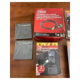 Outdoor Grill Accessories Lot Including Griddle Cleaning Kit, Grill Light, Propane Hose, Airtag Holders, and Bottle Opener Set