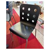 Set of 4 Modern Black Chairs with Circular Cutout Backs