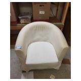 White Barrel Armchair with Red Striped Throw Blanket