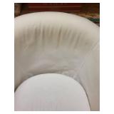 White Barrel Armchair with Red Striped Throw Blanket