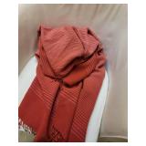 White Barrel Armchair with Red Striped Throw Blanket