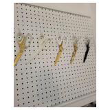 White Wall-Mounted Pegboard Organizer with Shelves and Scissors Holders