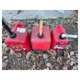 Three Gas Cans - 1 Gallon, 2 Gallon and 2 Gallon Cans