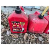 Three Gas Cans - 1 Gallon, 2 Gallon and 2 Gallon Cans