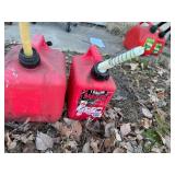 Three Gas Cans - 1 Gallon, 2 Gallon and 2 Gallon Cans