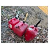 Three Gas Cans - 1 Gallon, 2 Gallon and 2 Gallon Cans