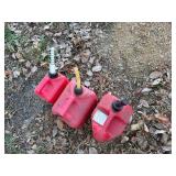 Three Gas Cans - 1 Gallon, 2 Gallon and 2 Gallon Cans