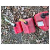 Three Gas Cans - 1 Gallon, 2 Gallon and 2 Gallon Cans