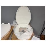 Two White Oblong Toilet Seats.  Unused. (One missing attachment pieces)