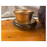 Four Unique Flower and Plant Containers with a Decorative Birdhouse