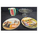 Kitchen Decor Lot with Watermelon Pitcher, Glass Cake Stand, and 2 Jeanne Down Collector Plates