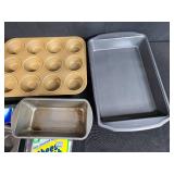 Assorted Bakeware Collection with Pans, Muffin Tins, Cheesecloth, and Baking Paper