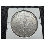 1885 Morgan Silver Dollar Marked AU58 When Purchased