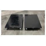 (2) black Uline Heavy Duty floor dolly. Both 40” L x 24” W