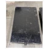 (2) black Uline Heavy Duty floor dolly. Both 40” L x 24” W