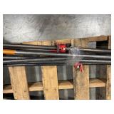 Black pipe bars, various lengths with red pipe clamps that have swing handles