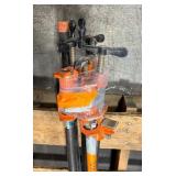 Pipe bars, various lengths with orange pipe clamps that have swing handles