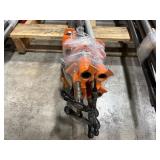 Pipe bars, various lengths with orange pipe clamps that have swing handles