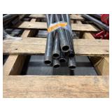 Black pipe bars with red pipe clamps that have swing handles