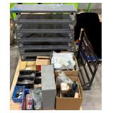 Pallet of Hardware, parts cabinet, a 6-shelf open metal storage unit, a black heavy-duty rail bin rack.