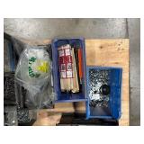 Pallet of Hardware, parts cabinet, a 6-shelf open metal storage unit, a black heavy-duty rail bin rack.