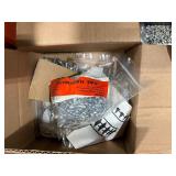 Pallet of Hardware, parts cabinet, a 6-shelf open metal storage unit, a black heavy-duty rail bin rack.