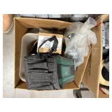 Pallet of Hardware, parts cabinet, a 6-shelf open metal storage unit, a black heavy-duty rail bin rack.