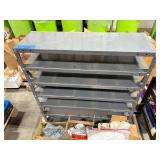 Pallet of Hardware, parts cabinet, a 6-shelf open metal storage unit, a black heavy-duty rail bin rack.