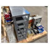 Pallet of Hardware, parts cabinet, a 6-shelf open metal storage unit, a black heavy-duty rail bin rack.
