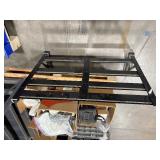 Pallet of Hardware, parts cabinet, a 6-shelf open metal storage unit, a black heavy-duty rail bin rack.