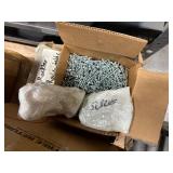 Pallet of Hardware, parts cabinet, a 6-shelf open metal storage unit, a black heavy-duty rail bin rack.