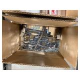 Utility Cart with slanted plastic bins holding hardware, box of coiled nails, and other items.