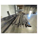 Assorted lot of metal scraps, some beams are 24’ long. Note: Shelving not included