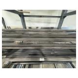 Assorted lot of metal scraps, some beams are 24’ long. Note: Shelving not included