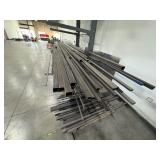 Assorted lot of metal scraps, some beams are 24’ long. Note: Shelving not included