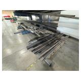 Assorted lot of metal scraps, some beams are 24’ long. Note: Shelving not included