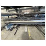 Assorted lot of metal scraps, some beams are 24’ long. Note: Shelving not included