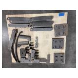 Flat bar braces, leaf springs, steel L-shaped brackets, steel slotted plates