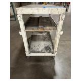 Mobile workbench with open sides and a middle and lower shelf. 43” x 24"