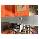 5-tier orange industrial shelf unit with 3" deep trays to prevent tools from slipping.