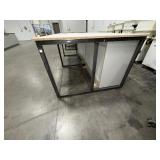Steel base w/laminated 4x8 top: bottom has one side open, one side retrofitted w/drawers & 2-door cabinet