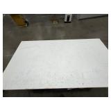 Steel base w/laminated 4x8 top: bottom has one side open, one side retrofitted w/drawers & 2-door cabinet