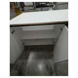 Steel base w/laminated 4x8 top: bottom has one side open, one side retrofitted w/drawers & 2-door cabinet