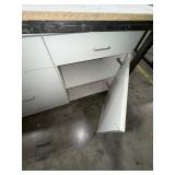 Steel base w/laminated 4x8 top: bottom has one side open, one side retrofitted w/drawers & 2-door cabinet