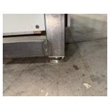 Steel base w/laminated 4x8 top: bottom has one side open, one side retrofitted w/drawers & 2-door cabinet