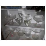 Wooden shelf with assorted glassware