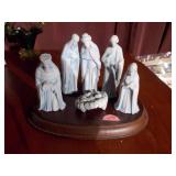 The image shows a set of porcelain figurines from the "The Christmas Story" nativity set