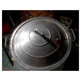 Huge metal pot, like a wok.