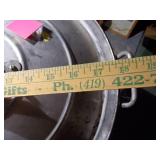 Huge metal pot, like a wok.